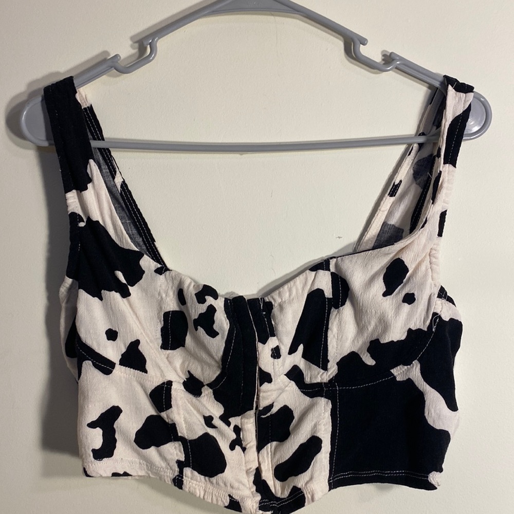 Brand new, cow print crop top with rib detailing, and front clasps, size large